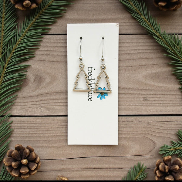 Matte silver Christmas tree earrings in minimalist style on Freckle Face card – whimsical holiday jewellery