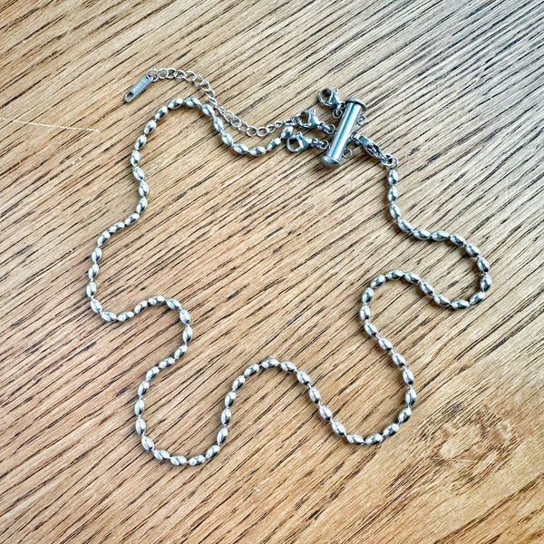 Modern ball chain necklace with 6 mm x 3 mm beads displayed flat