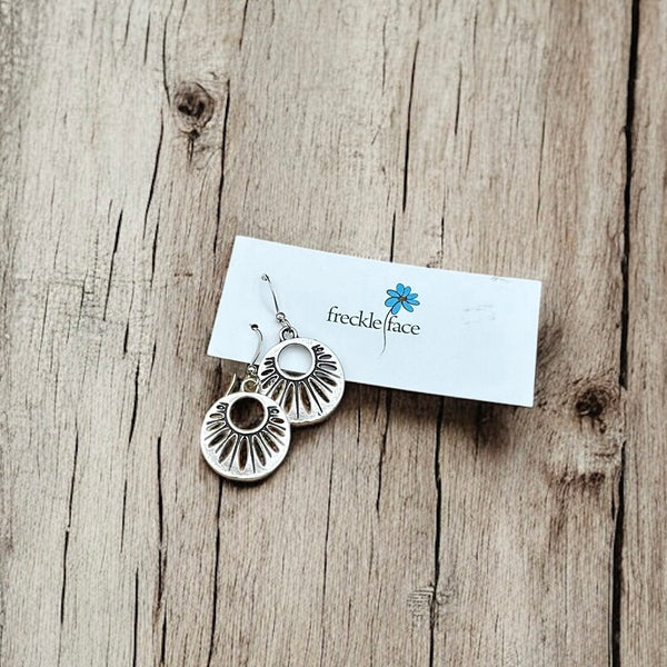 Lightweight silver floral earrings on French hooks with silicone stoppers