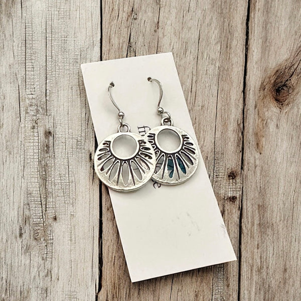 Rustic hypoallergenic petal dangle earrings in matte silver on jewelry card