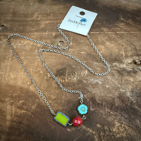 Colorful bead necklace with Czech glass beads on an 18 inch stainless steel chain displayed on wood background