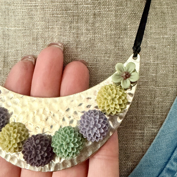 Bloom Garden Statement Necklace – Hammered Silver & Floral Crescent (Black Satin Ribbon)