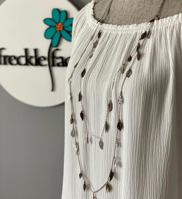 Hypoallergenic long chain necklace with delicate silver and gold-toned leaves