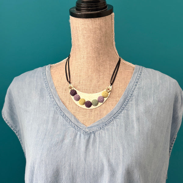 Bloom Garden Statement Necklace – Hammered Silver & Floral Crescent (Black Satin Ribbon)
