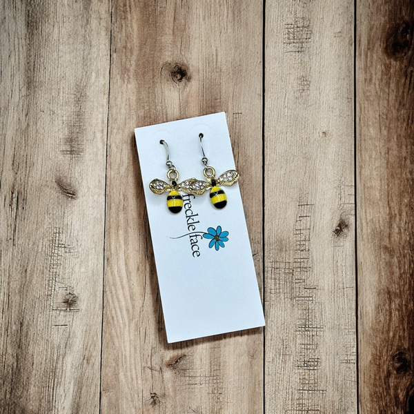 Nature-inspired bee earrings with rhodium hooks and silicone backs