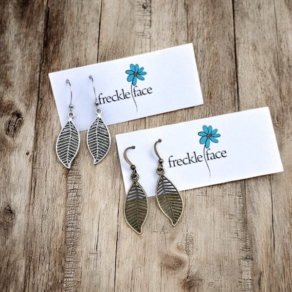 Lightweight Nature-inspired leaf earrings styled on wood table