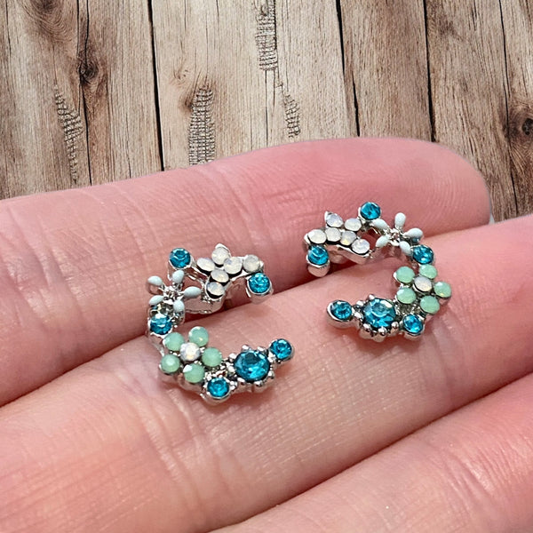 Vintage inspired flower crescent shape stud earrings with non tarnishing rhodium plating and blue vibrant colors