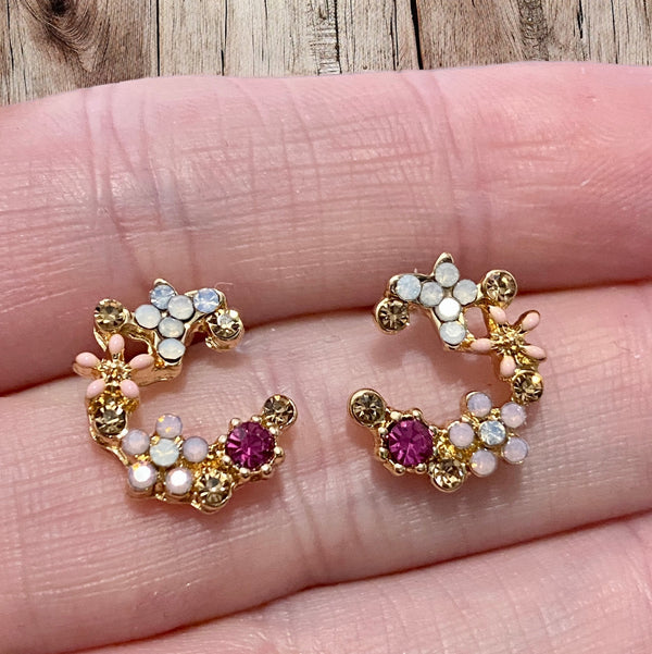 Vintage inspired flower crescent shape stud earrings with gold plating and pinks and orange colors