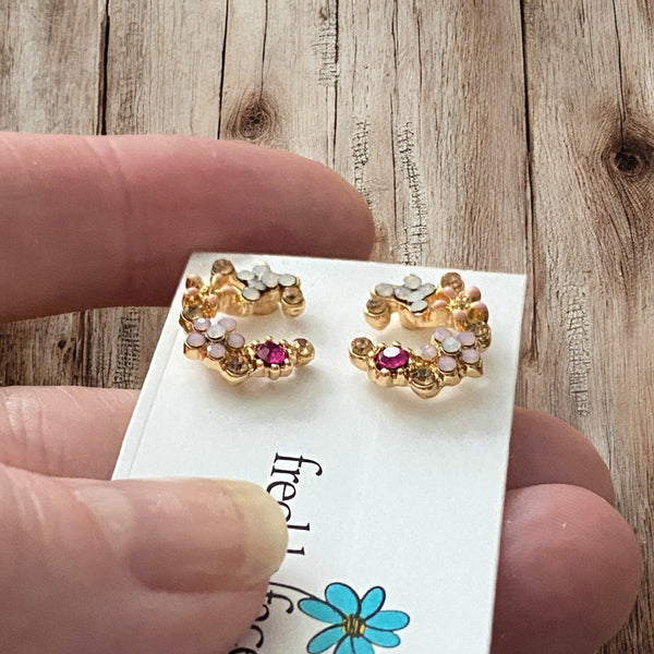 Pretty fuchsia and light pink floral design studs with gold plating and silicone backs