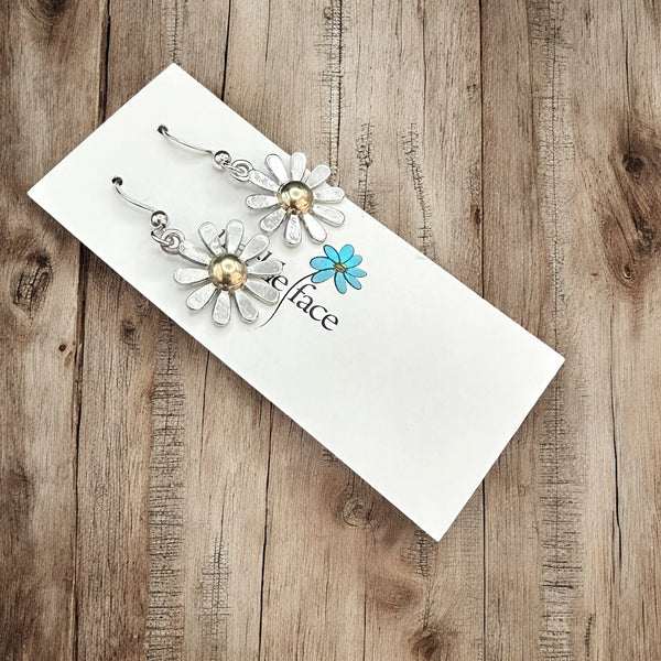 Daisy hook earrings displayed hanging on earring card