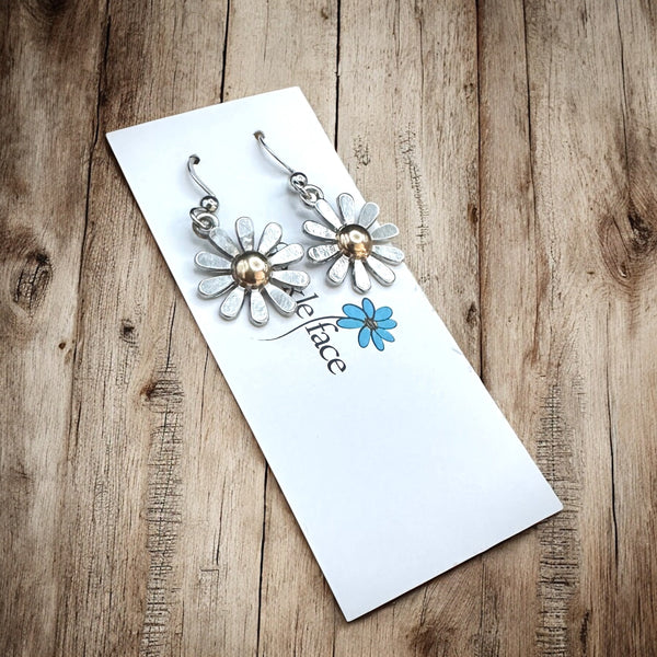 Silver and gold daisy earrings with french hooks and silicone stoppers