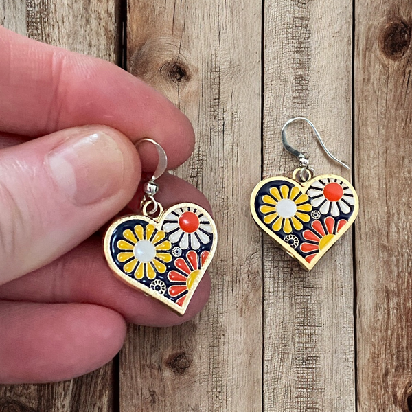 Close-up of playful enamel petals and gold-tone centers on flower power earrings