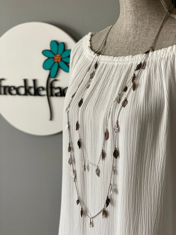 Mannequin wearing long Waterfall Leaf Necklace in the short and long length