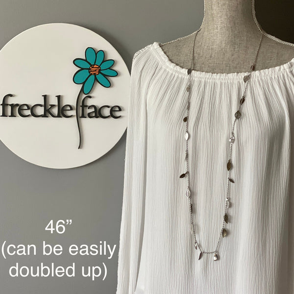 Waterfall leaf necklace on a 46” boho length chain on a mannequin