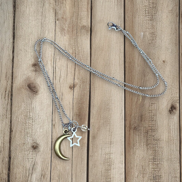 Under the Same Sky moon and star necklace shown on full length on 18” stainless steel chain