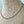 stainless steel beaded chain necklace on a mannequin bust against a textured fabric background