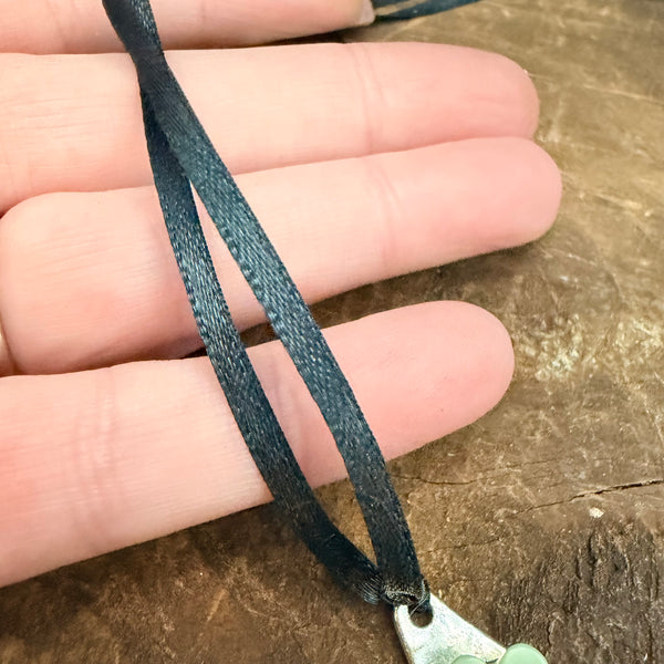 Bloom Garden Statement Necklace – Hammered Silver & Floral Crescent (Black Satin Ribbon)