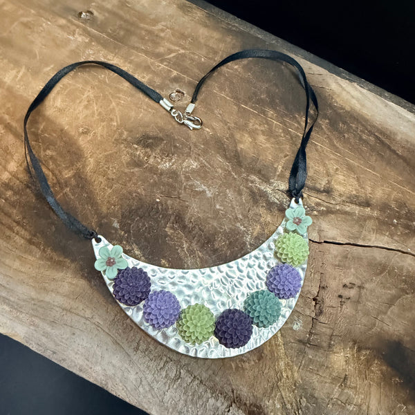 Bloom Garden Statement Necklace – Hammered Silver & Floral Crescent (Black Satin Ribbon)