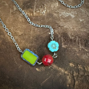 Close up of the colorful Czech glass bead trio. Green turquoise and red