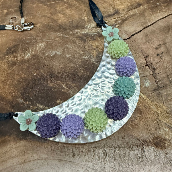Bloom Garden Statement Necklace – Hammered Silver & Floral Crescent (Black Satin Ribbon)