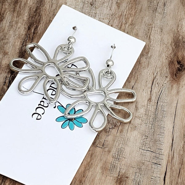 Abstract flower hook earrings in a non tarnishing rhodium finish.