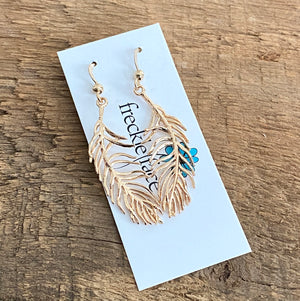 Delicate gold feather earrings